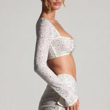 Kaunistatud pikakäised crop top valges