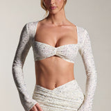 Kaunistatud pikakäised crop top valges
