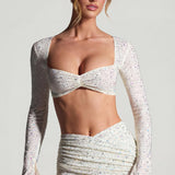 Kaunistatud pikakäised crop top valges